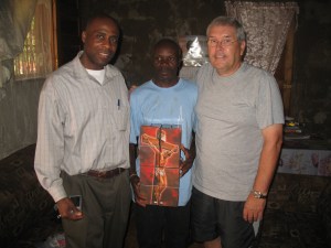 Pastor Zacharie with Wilfrid and Nelson receiving evangelism materials